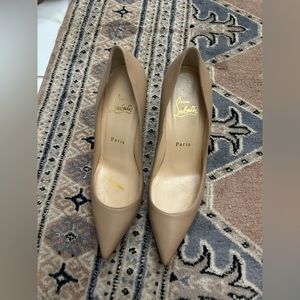 Christian Louboutin pumps.